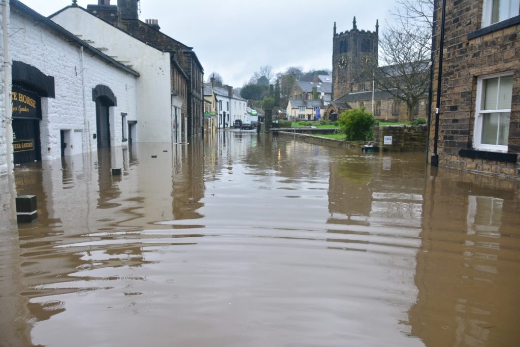 A flood in the UK, showing the need for climate adaptation in some areas.