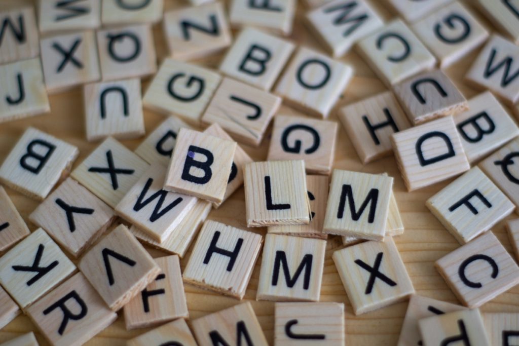 Image of letters on wooden tiles to illustrate language.