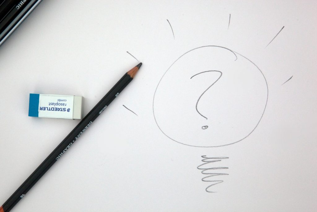 AI and SEO strategy - An Image of a question mark drawn on paper to illustrate thinking of strategy