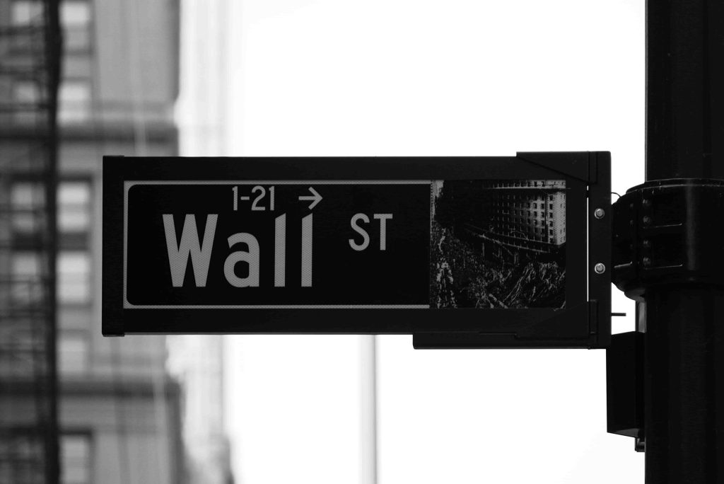 Photo of the "Wall St" sign in New York.